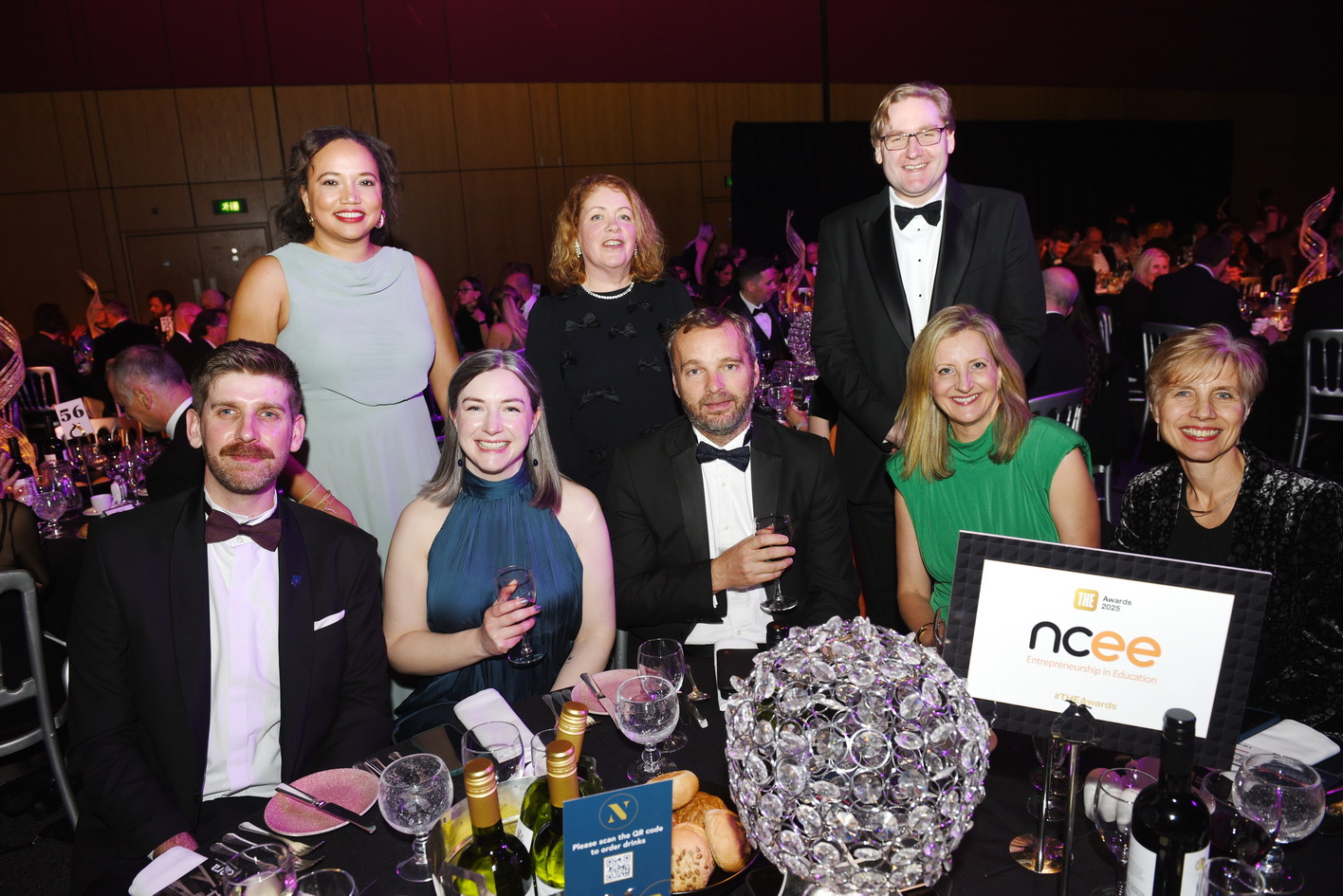 Table group photo of guests at a corporate Conference photography example