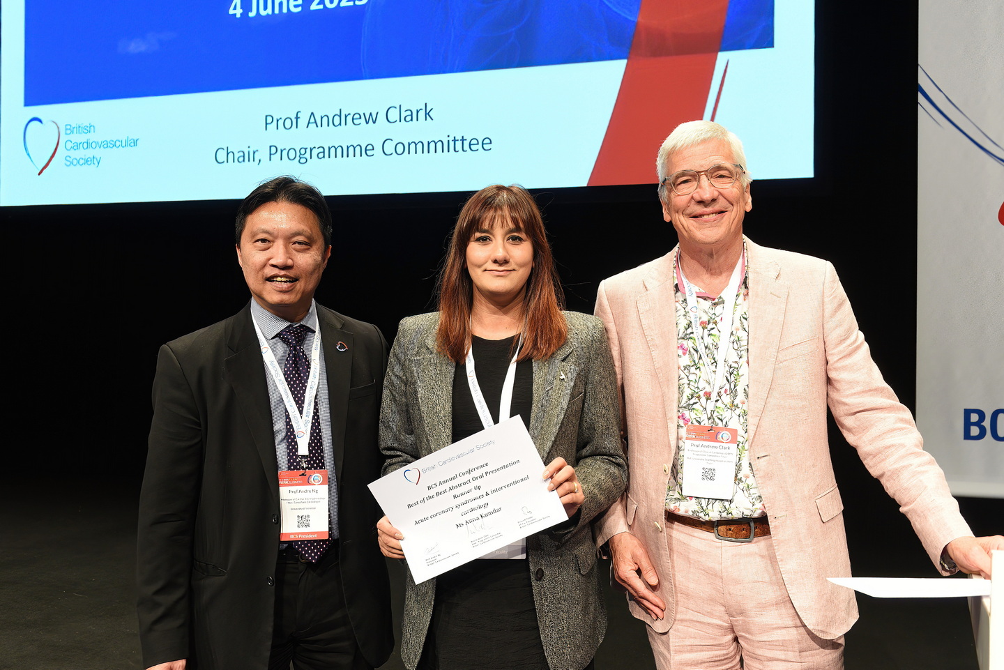 Award presentation on stage at a business event