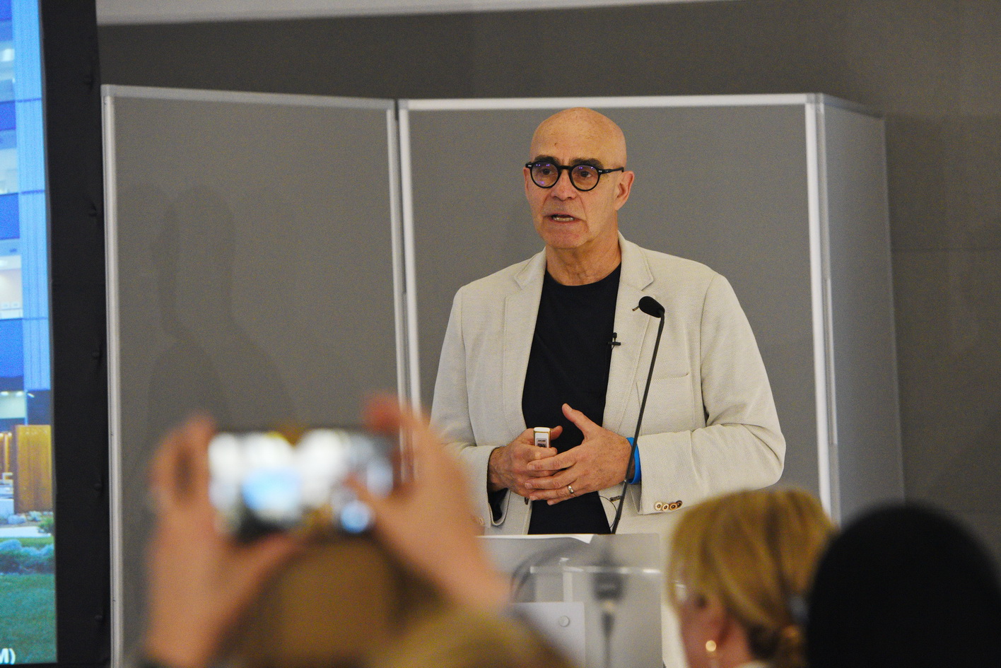 Conference presenter delivering a session