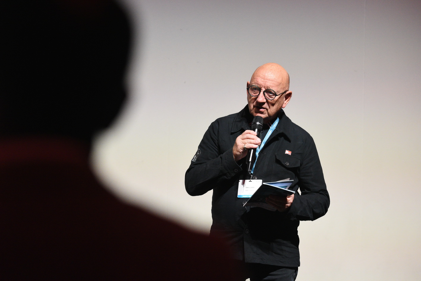 Evening presentation with speaker and audience