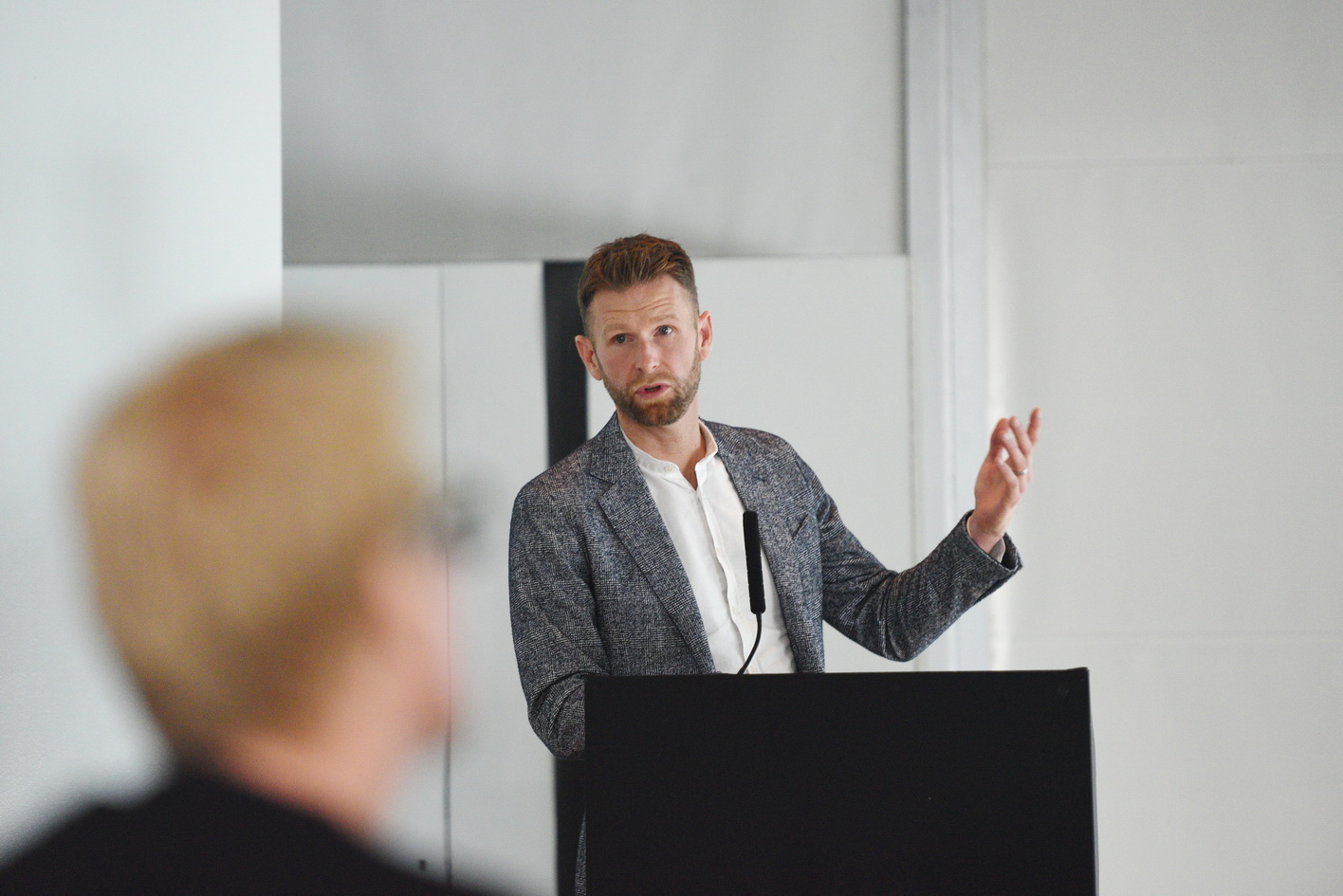 Guest speaker addressing a conference audience