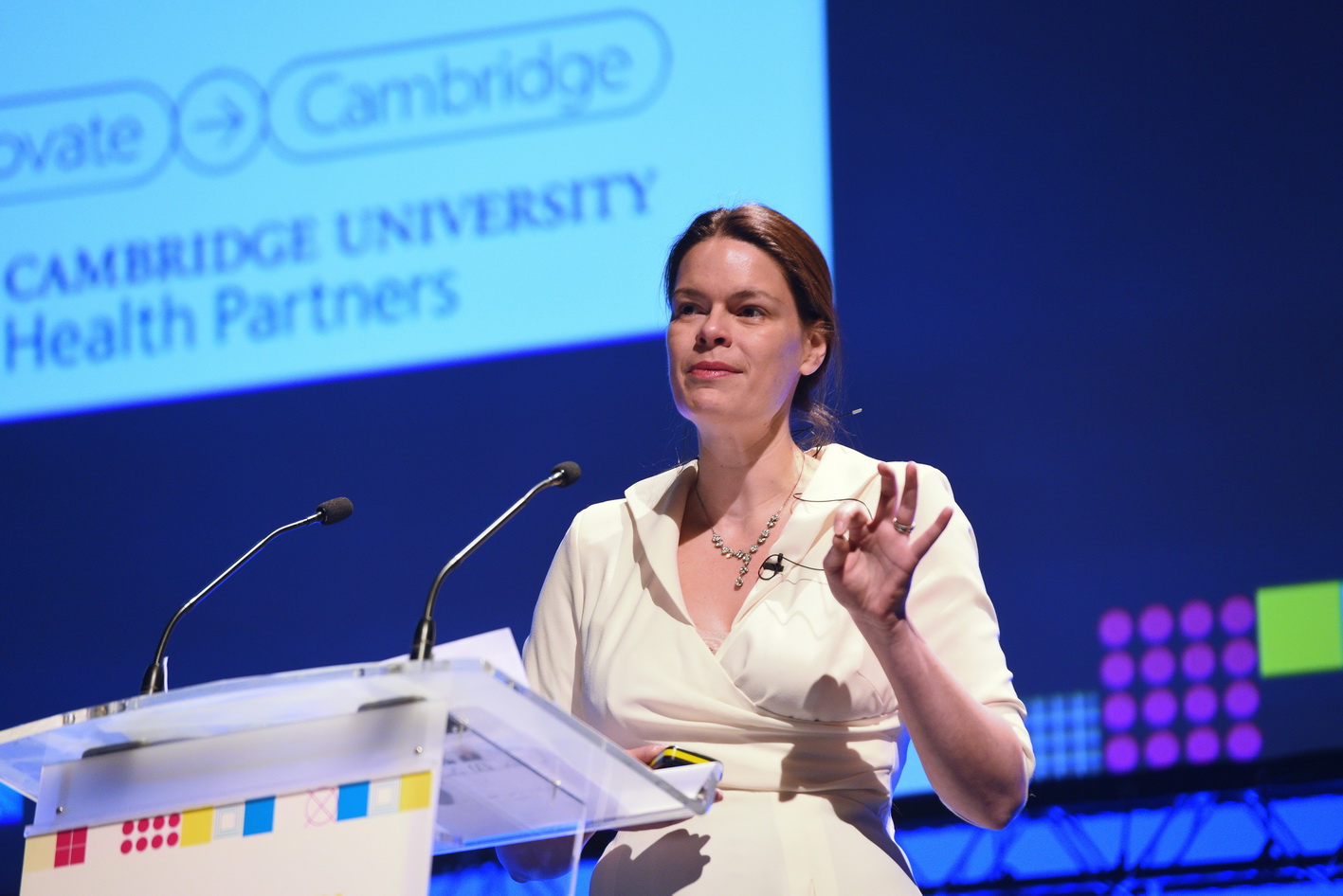 Keynote speaker on stage at a conference