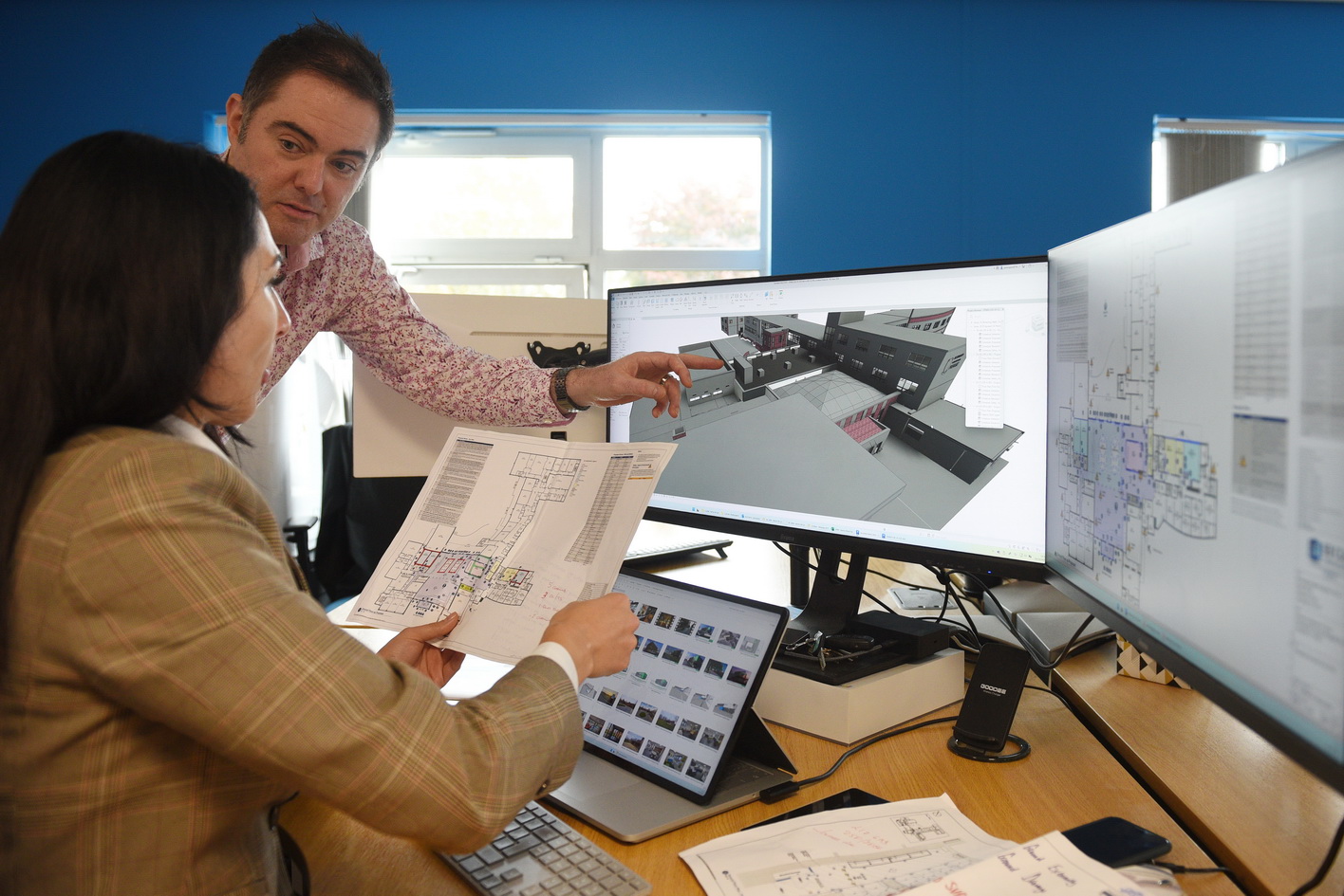 Architects photographed in their office environment