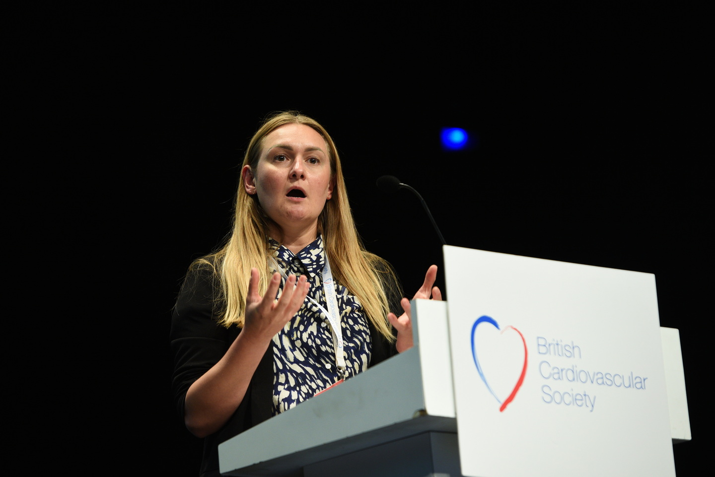 Presentation speaker captured mid-delivery