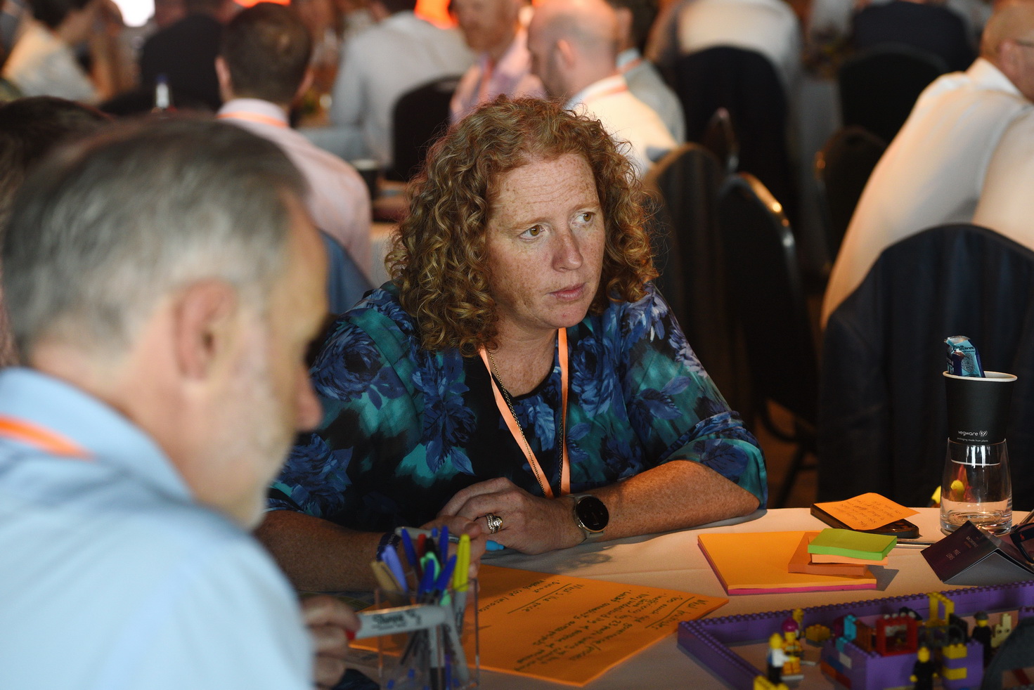 Delegate listening at corporate event