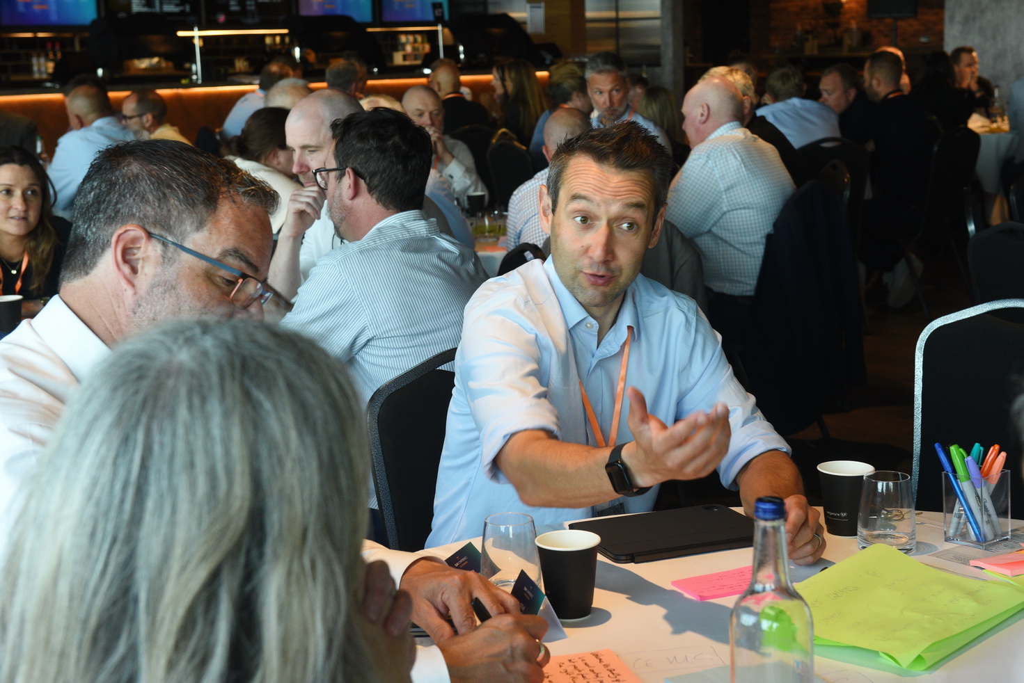 Intense business discussion at corporate event