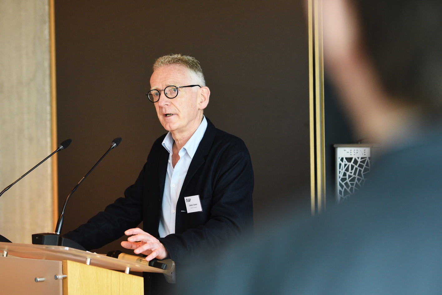 Conference speaker presenting